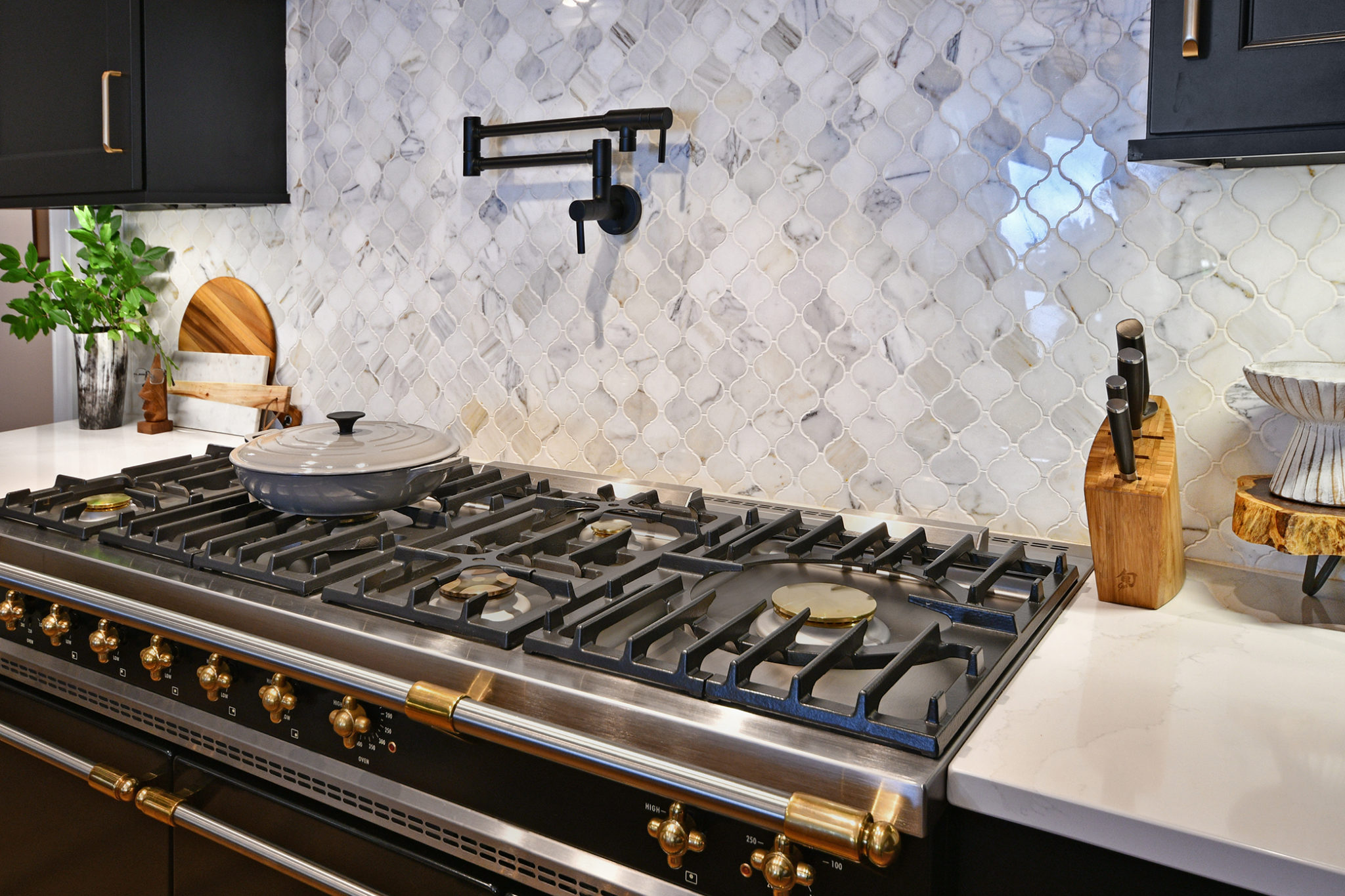 Kitchen with Gold Hardware and Stove Pot Filler